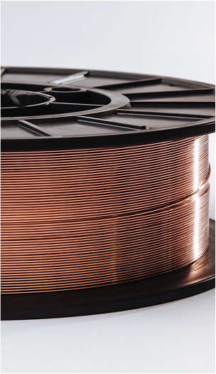 Close-up of a copper-colored MIG welding wire spool on a black plastic reel.