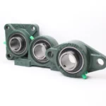 Three PGN pillow block bearings in green cast iron housings.
