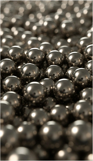 Close-up view of polished stainless steel balls stacked together.